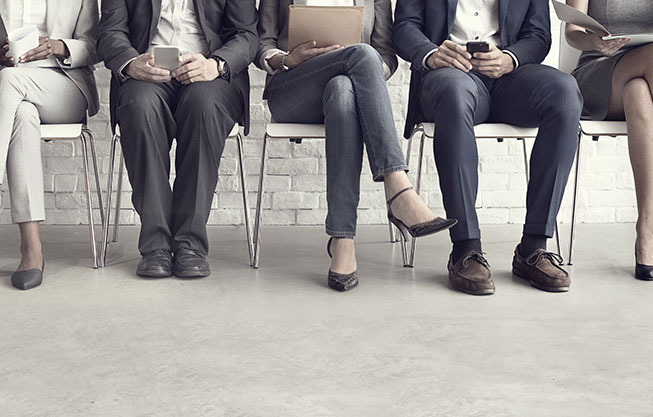 job seekers lined up in chairs