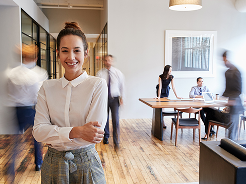 woman standing in busy office